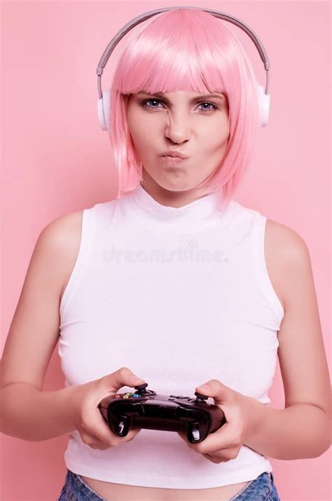 Happy Gamer Girl With Pink Hair Playing Video Games Using Joystick Happy Gamer Girl With Pink Hair Playing Video Games Using Joystick